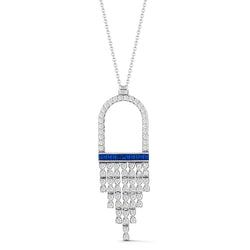 18k white gold flexible fringe pendant with white round diamonds and blue sapphire baguettes. Attached to 18 inch chain.