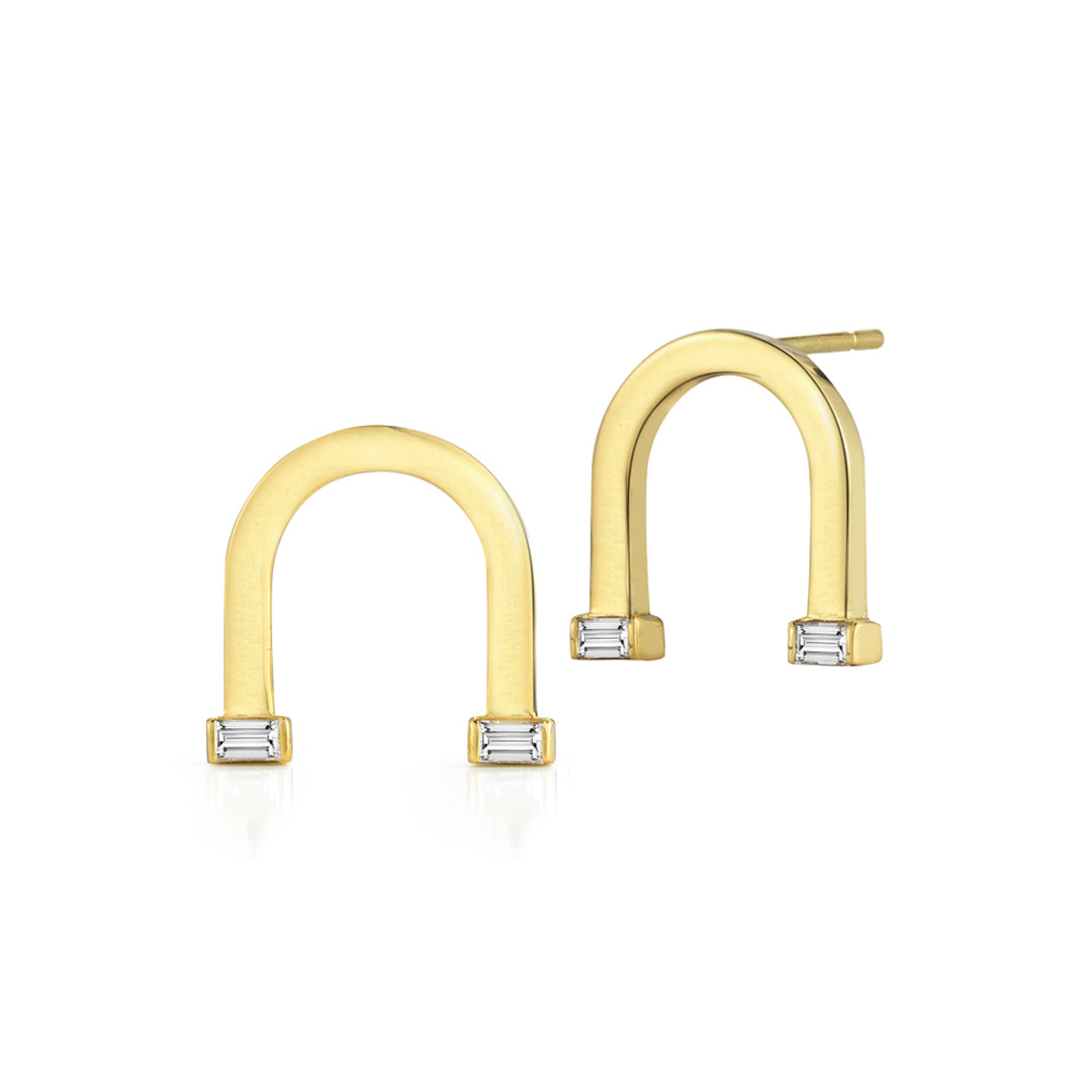 18k yellow gold earrings set with white diamond baguettes.