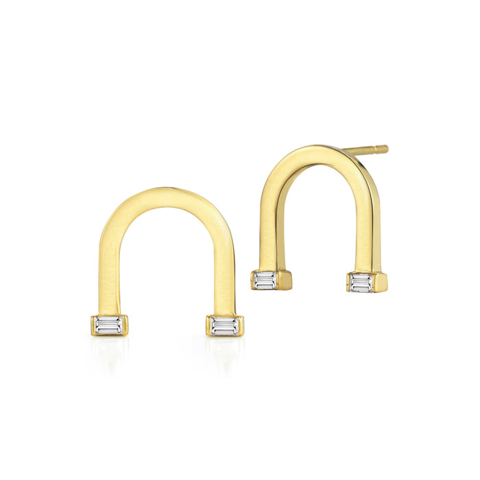 18k yellow gold earrings set with white diamond baguettes.